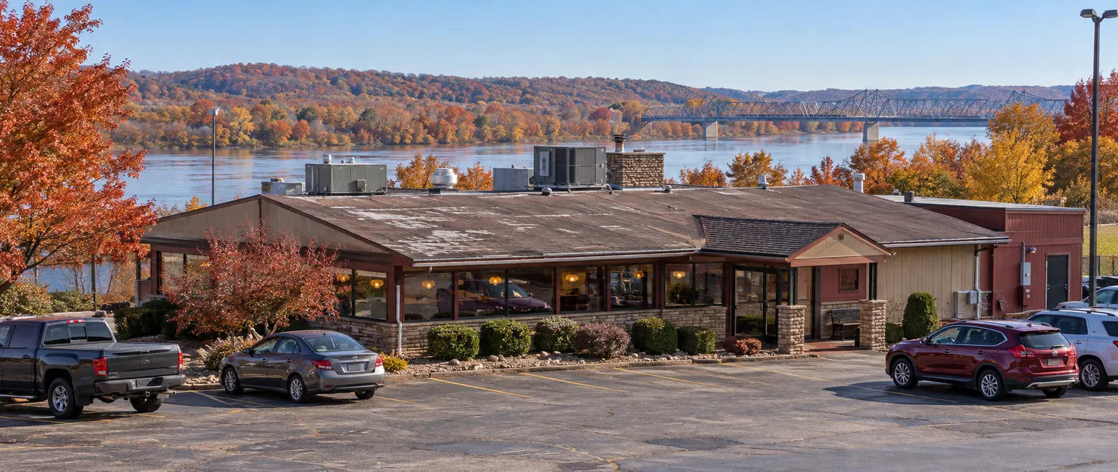 Wide view of a commercial building with a long metal roof
